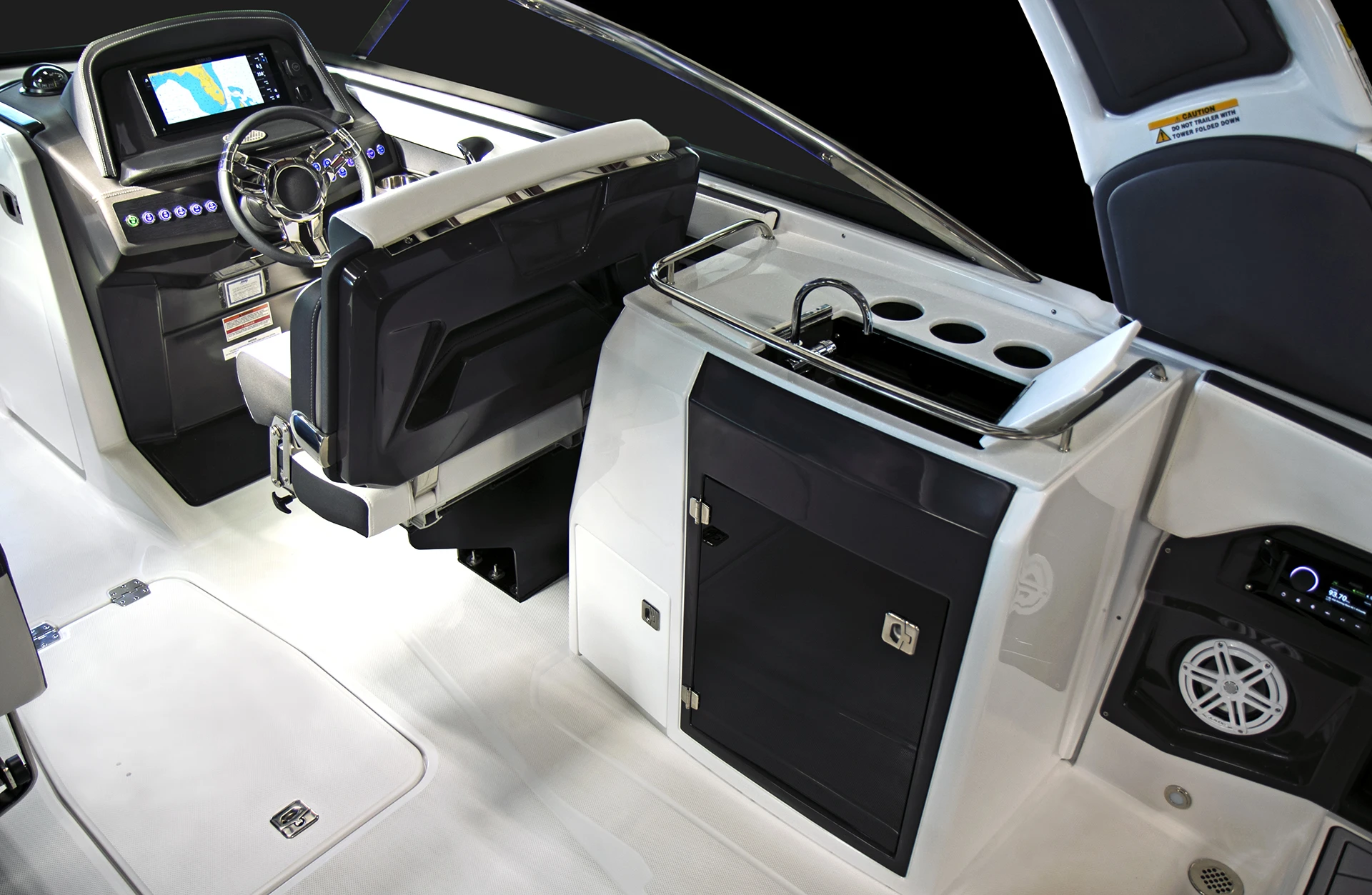 Helm and wet bar area on the 275SS, complete with sink, cup holders, and audio system