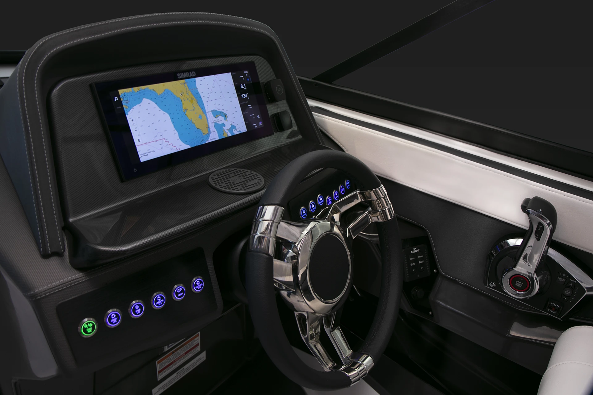Close-up view of the 278SS helm featuring Simrad touchscreen navigation and chrome steering wheel.