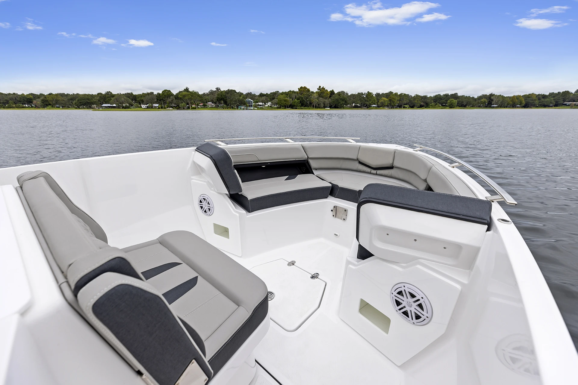 Spacious bow lounge seating with diamond-stitched upholstery on the Monterey Elite 27 OB