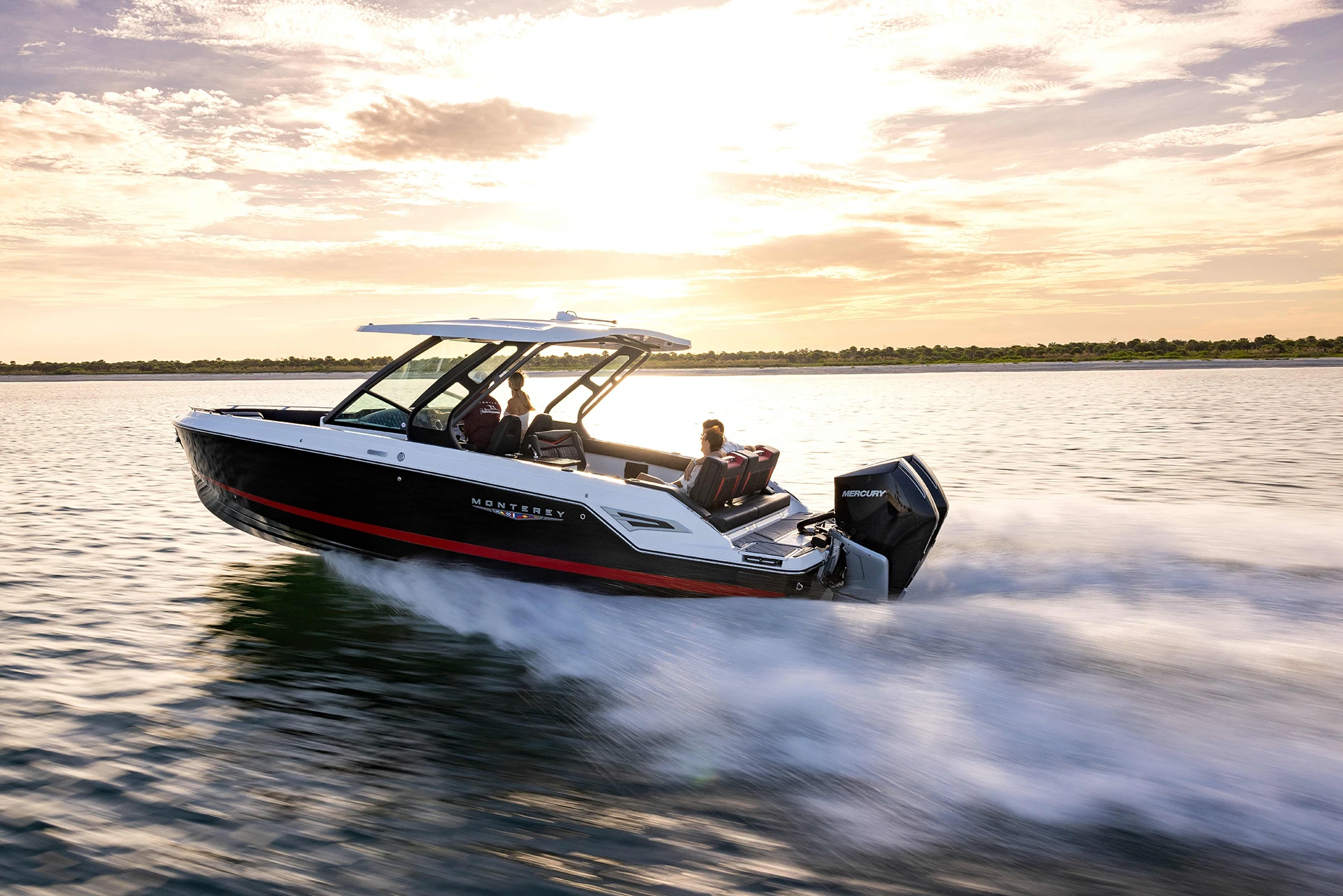 Monterey Elite 30 OB underway at speed, showing sleek profile and dual Mercury outboards