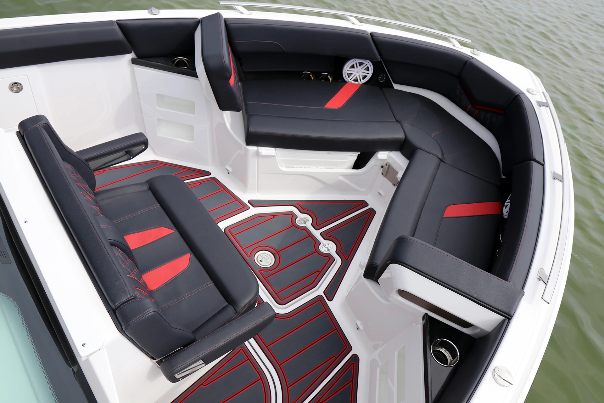 Forward bow lounge seating with premium black and red upholstery and JL audio speakers