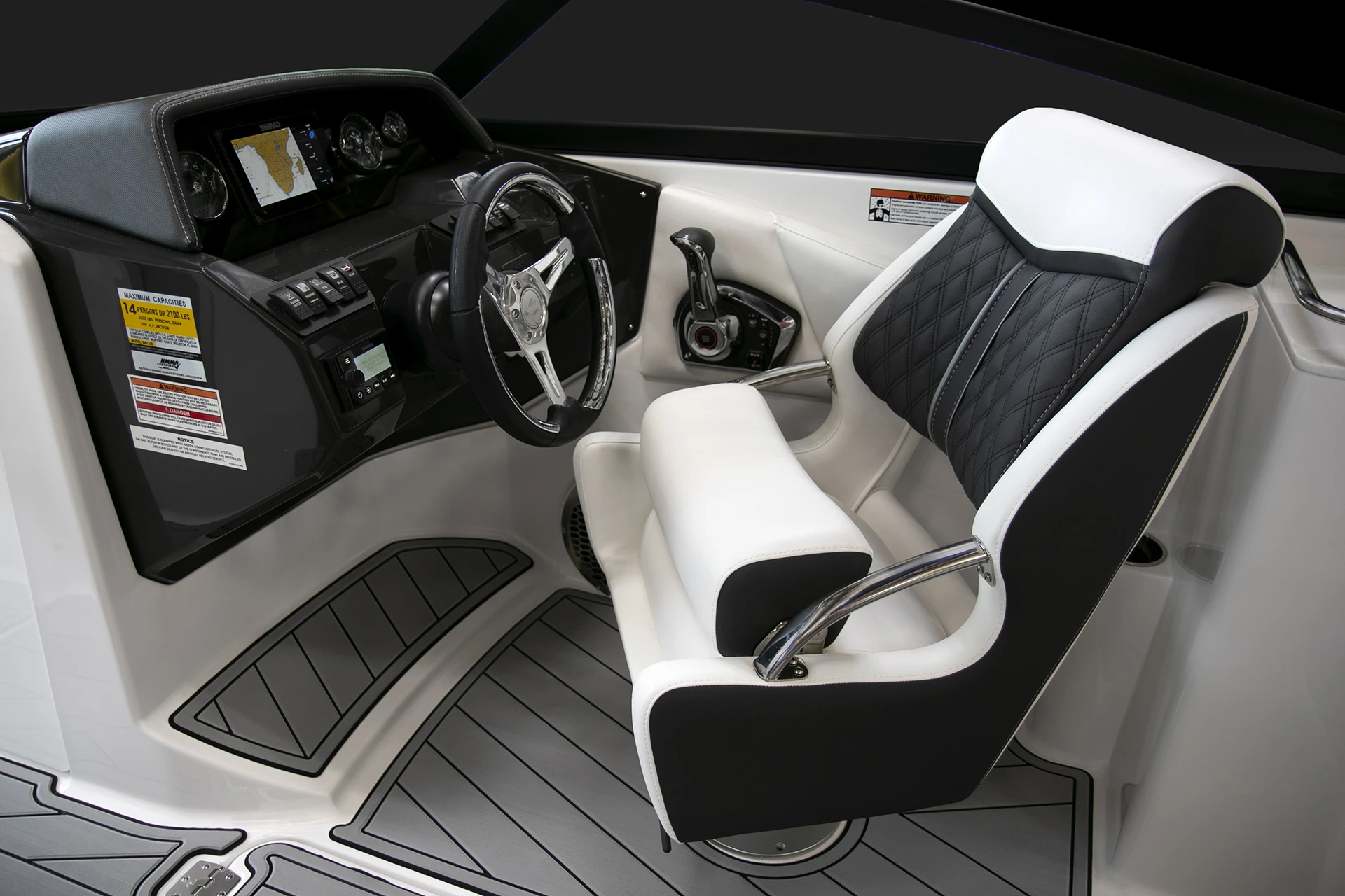Helm station of the Monterey M4 with tilt steering wheel, black-and-white captain’s chair, and Simrad electronics