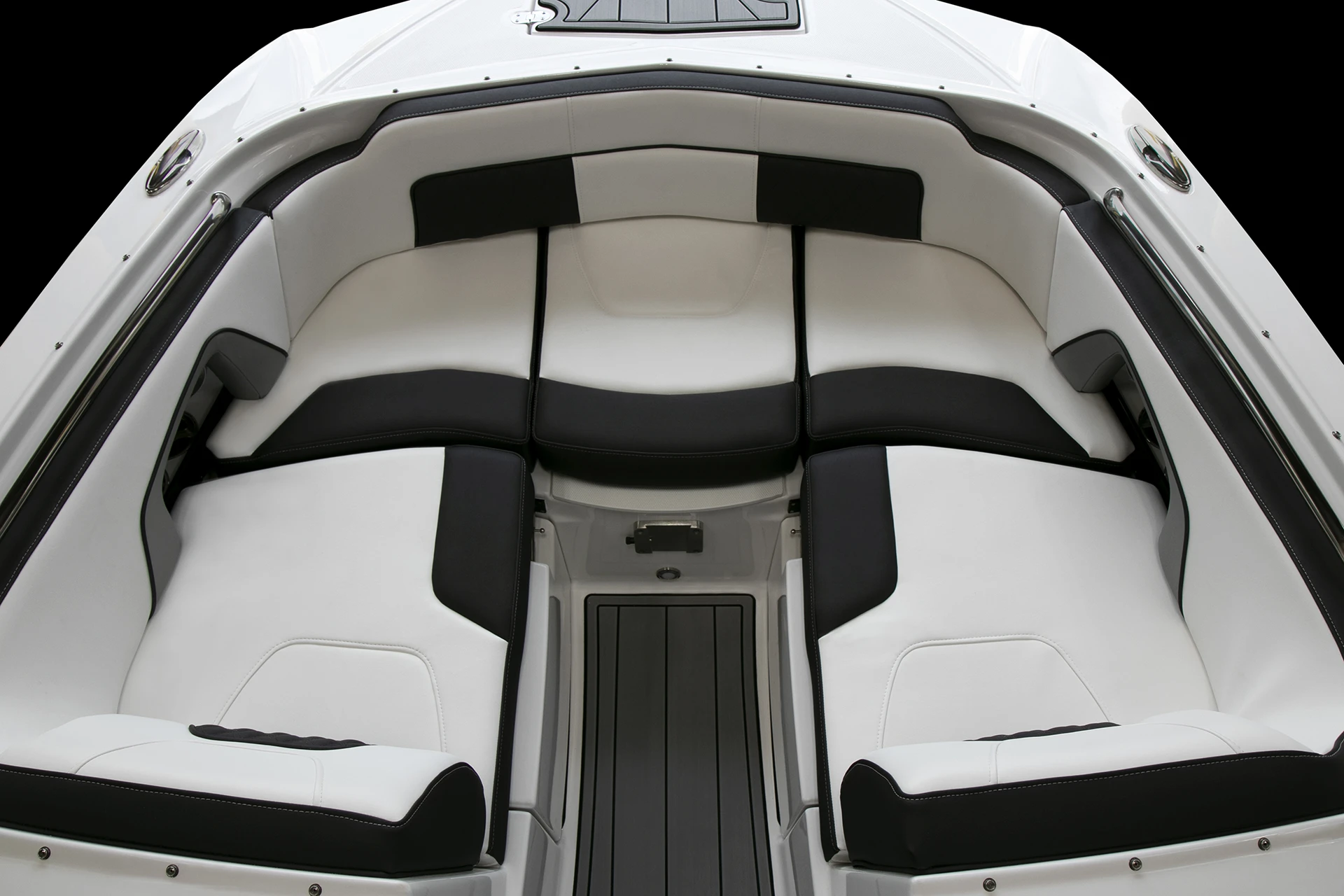Spacious bow lounge seating aboard the Monterey M4 with white and black upholstery and storage beneath