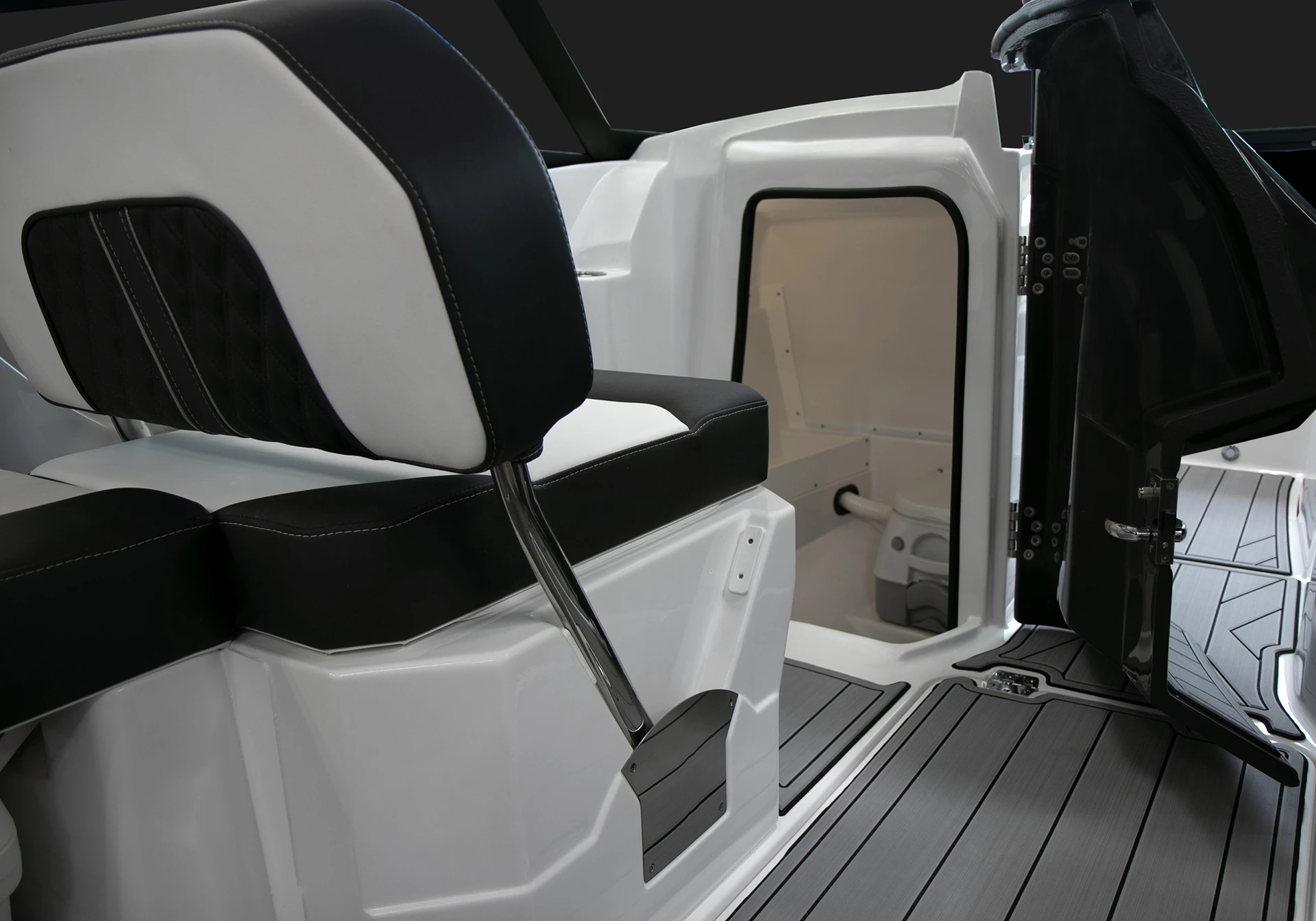 Entry to the enclosed head compartment on the Monterey M4 located behind the portside helm seat