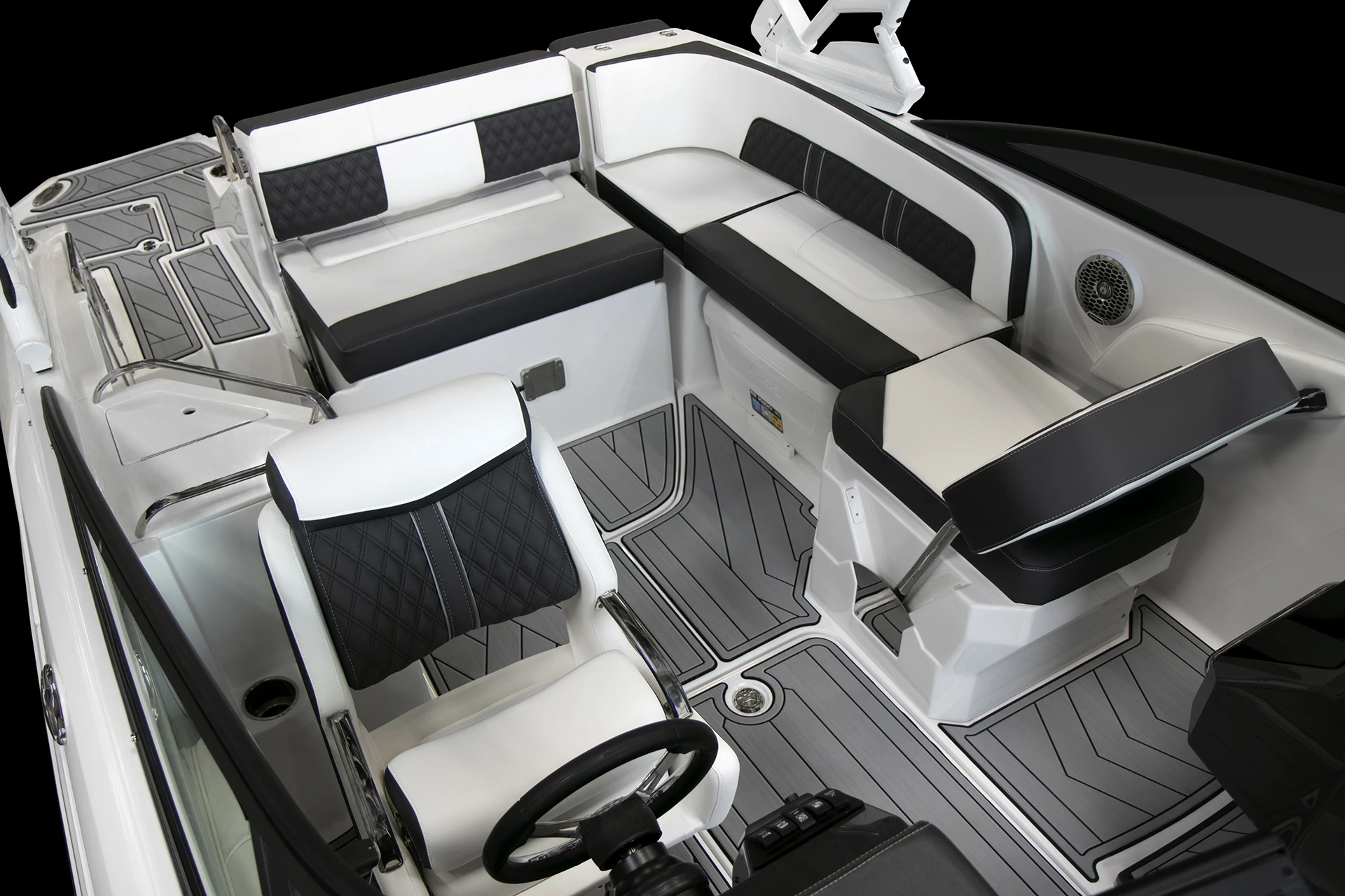 Cockpit overview of the Monterey M4 showing dual helm chairs, wraparound lounge seating, and gray SeaDek flooring