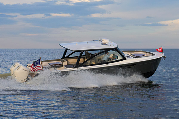 MJM 38V underway on open water at sunset